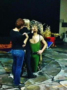 Olivier Laquerre has to kneel down so that the make-up team can do touch-ups for Persee